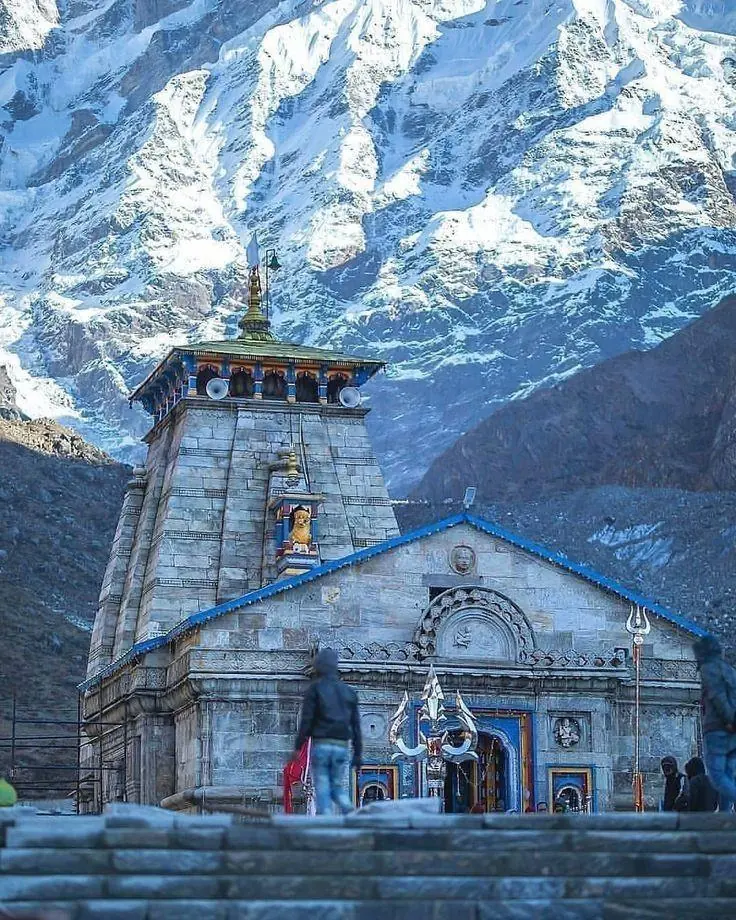 Kedarnath Temple below snow-covered mountains