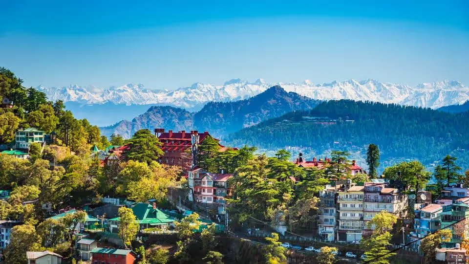 Shops lit up along the Mall Road in Shimla