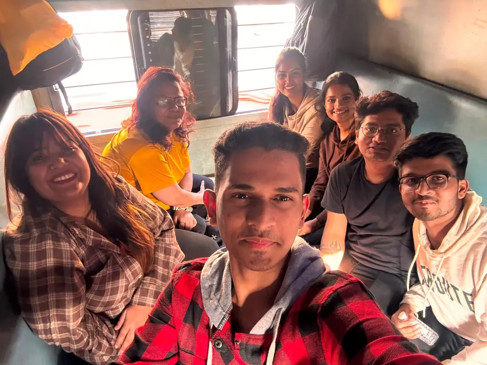 Group of travellers smiling on the train